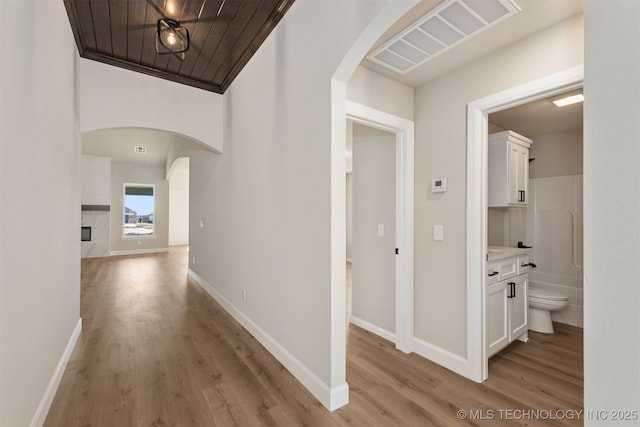 corridor featuring light hardwood / wood-style flooring