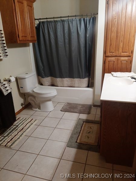 full bathroom featuring vanity, tile patterned flooring, toilet, and shower / bathtub combination with curtain