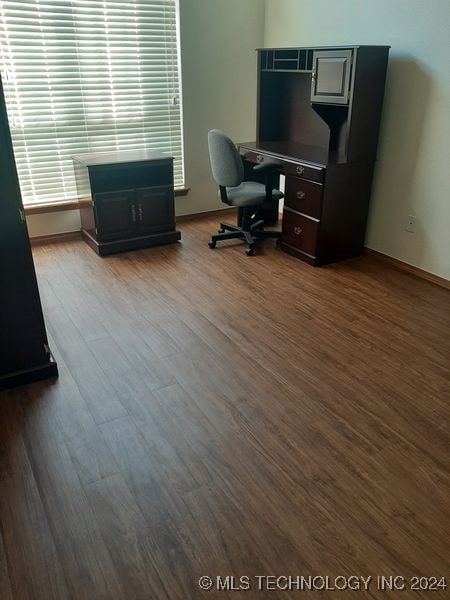 office space with wood-type flooring