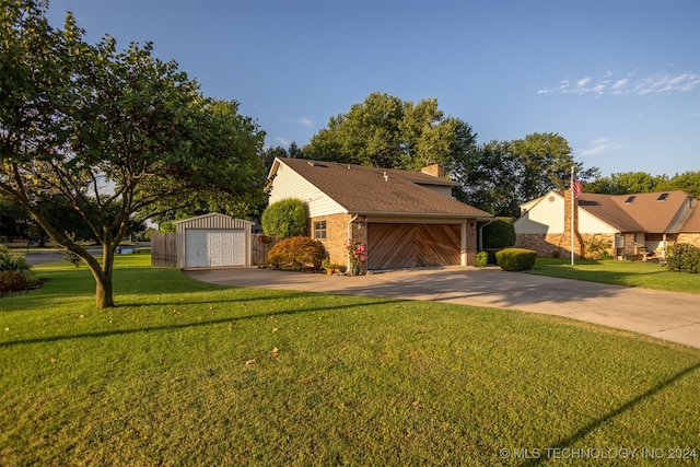 view of front of house with a front lawn and an outbuilding