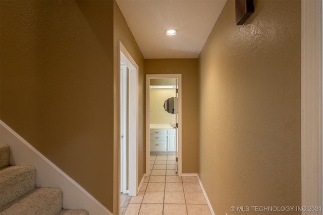 corridor featuring light tile patterned flooring