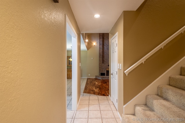 hallway featuring light tile patterned flooring