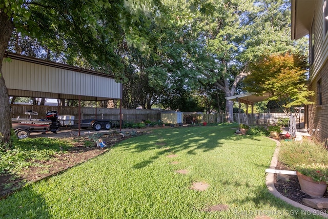 view of yard with a carport