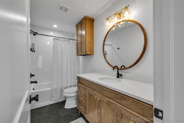 full bathroom featuring shower / tub combo with curtain, vanity, toilet, and tile patterned floors