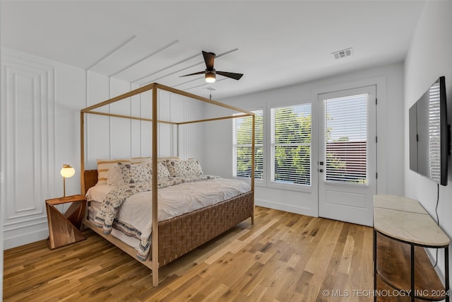 bedroom with ceiling fan, light wood-type flooring, and access to outside