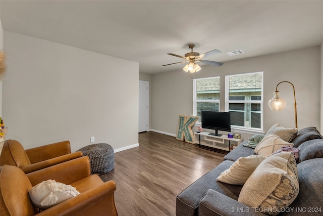 living room featuring ceiling fan and hardwood / wood-style flooring