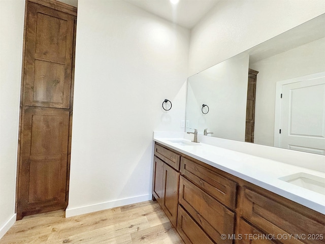 bathroom featuring vanity and hardwood / wood-style floors