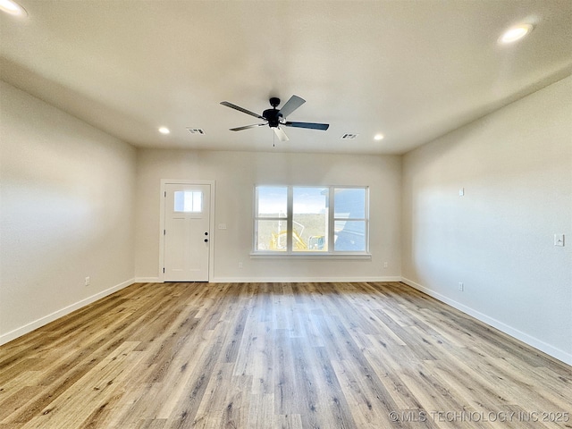 entrance foyer featuring ceiling fan, plenty of natural light, and light hardwood / wood-style floors