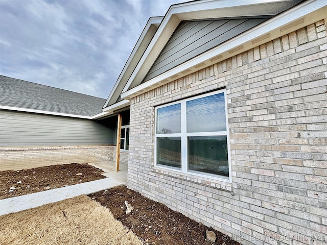 exterior space with brick siding