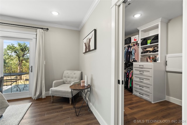 sitting room with crown molding and dark hardwood / wood-style flooring