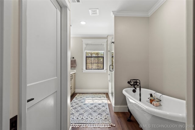 bathroom with shower with separate bathtub, wood-type flooring, vanity, and crown molding