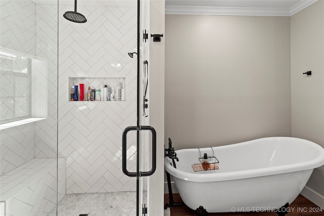 bathroom featuring separate shower and tub and crown molding