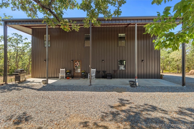 rear view of house featuring a patio