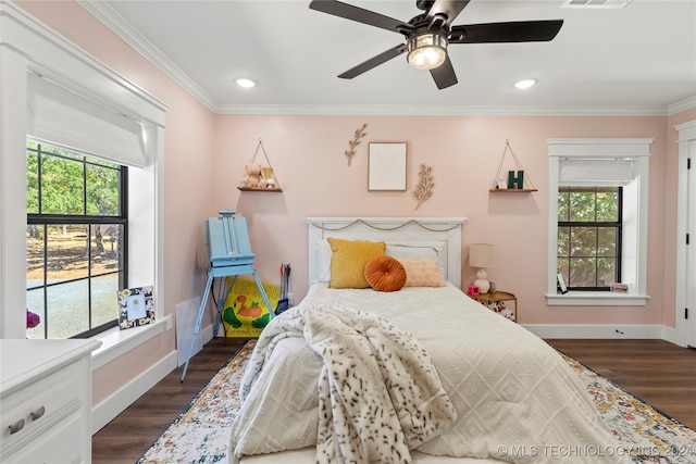 bedroom featuring ornamental molding, ceiling fan, and dark hardwood / wood-style floors