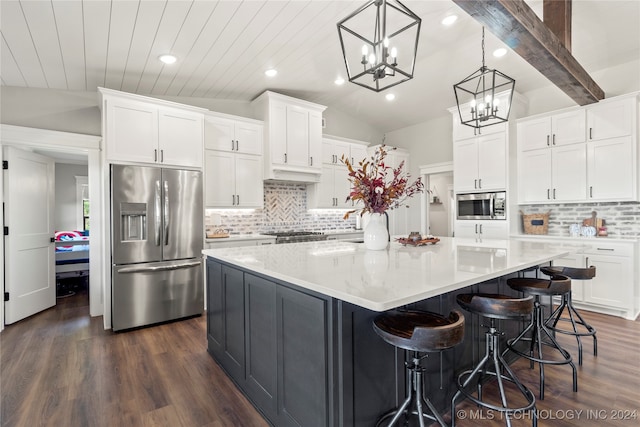 kitchen with white cabinetry, lofted ceiling with beams, stainless steel appliances, and a spacious island