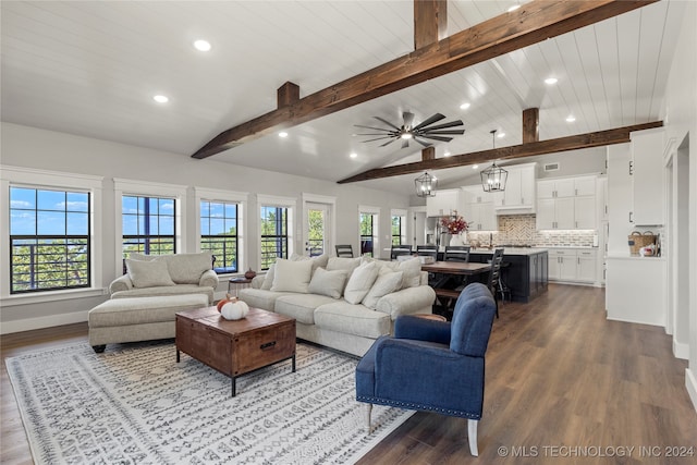 living room with vaulted ceiling with beams, ceiling fan with notable chandelier, and hardwood / wood-style floors