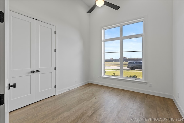 spare room featuring ceiling fan and light wood-type flooring