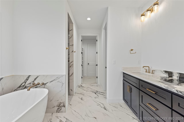 bathroom featuring vanity and a bathing tub