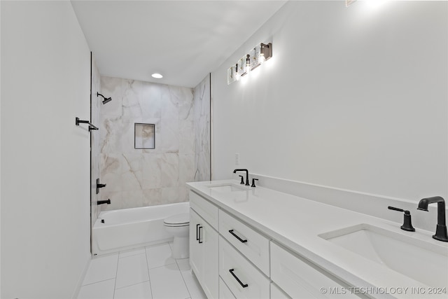 full bathroom featuring tile patterned flooring, vanity, toilet, and tiled shower / bath