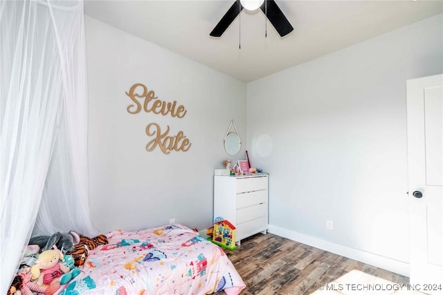 bedroom with hardwood / wood-style floors and ceiling fan