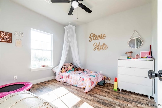 bedroom with wood-type flooring and ceiling fan