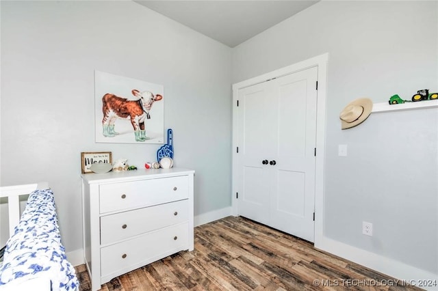 bedroom featuring dark hardwood / wood-style flooring