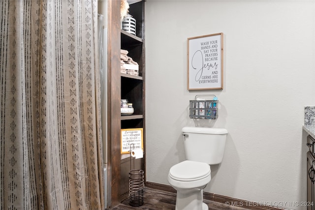 bathroom with vanity, hardwood / wood-style floors, and toilet