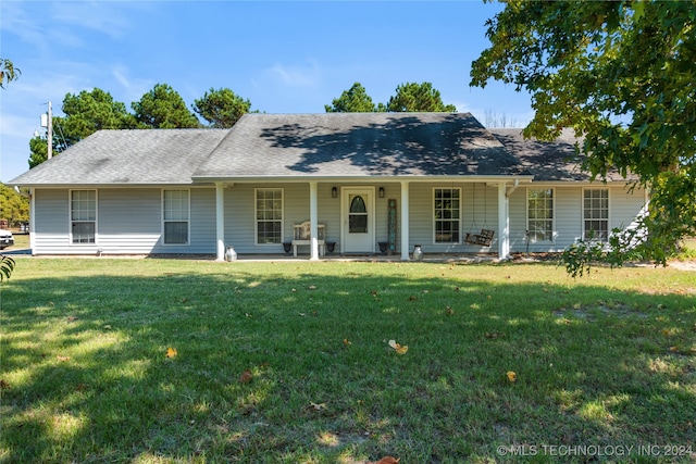 view of front of house with a porch and a front yard