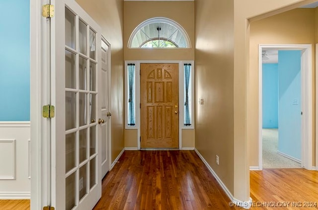 foyer entrance with hardwood / wood-style floors