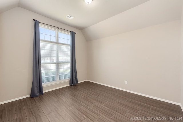 additional living space with vaulted ceiling