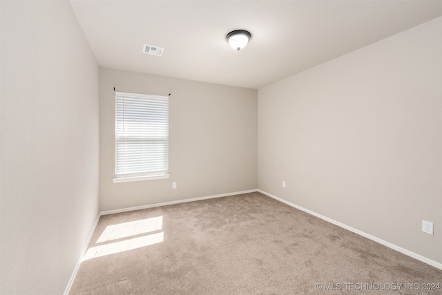 empty room featuring carpet flooring