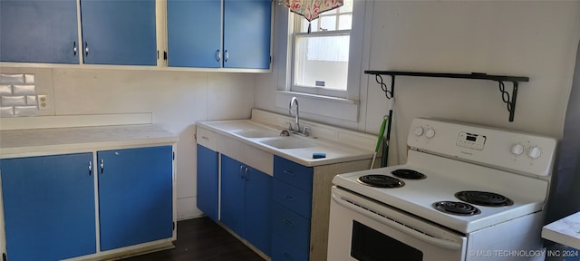 kitchen with dark hardwood / wood-style floors, blue cabinets, white range with electric cooktop, and sink