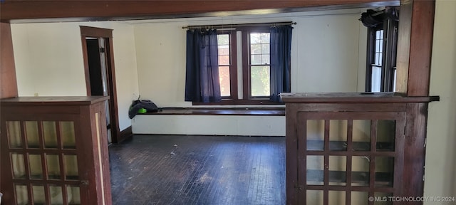 unfurnished room with dark hardwood / wood-style floors