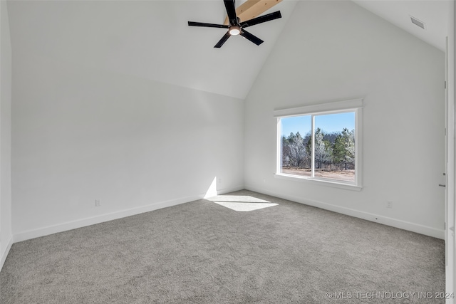 spare room featuring high vaulted ceiling, ceiling fan, and carpet floors