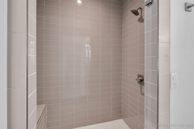 bathroom with a tile shower