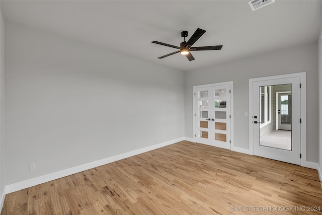 empty room with light hardwood / wood-style flooring and ceiling fan