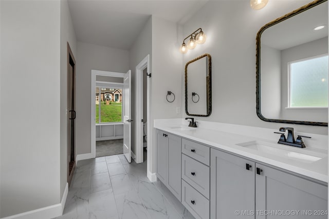 bathroom featuring vanity and plenty of natural light