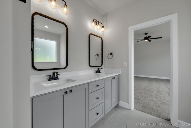 bathroom featuring ceiling fan and vanity