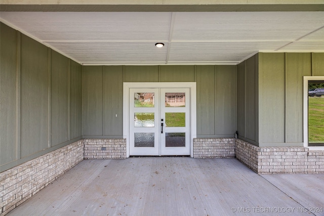 view of exterior entry featuring french doors