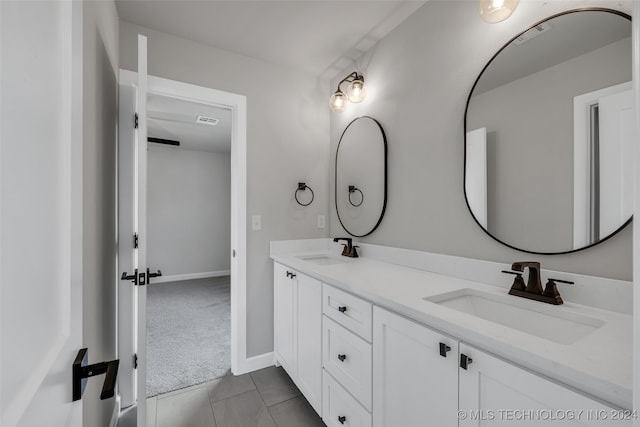 bathroom featuring tile patterned floors and vanity