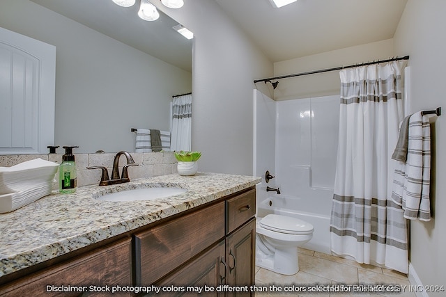 full bathroom with vanity, shower / bath combo with shower curtain, toilet, and tile patterned floors