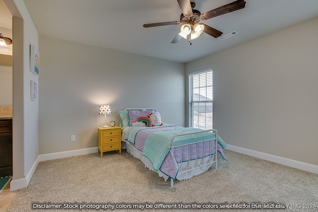 bedroom featuring light carpet and ceiling fan