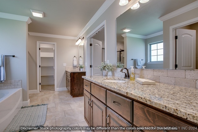 bathroom featuring a bathtub, crown molding, tile patterned flooring, and vanity