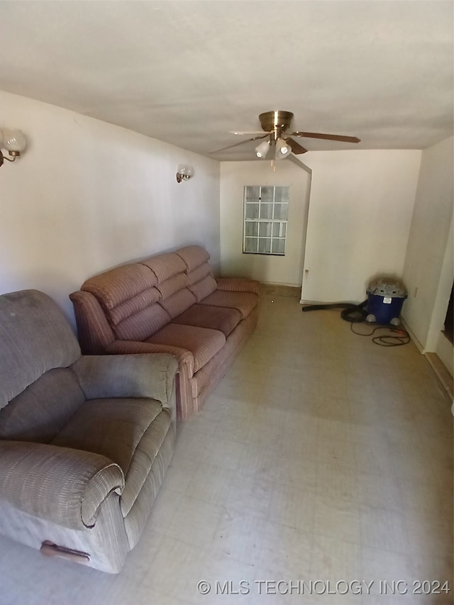 unfurnished living room with ceiling fan