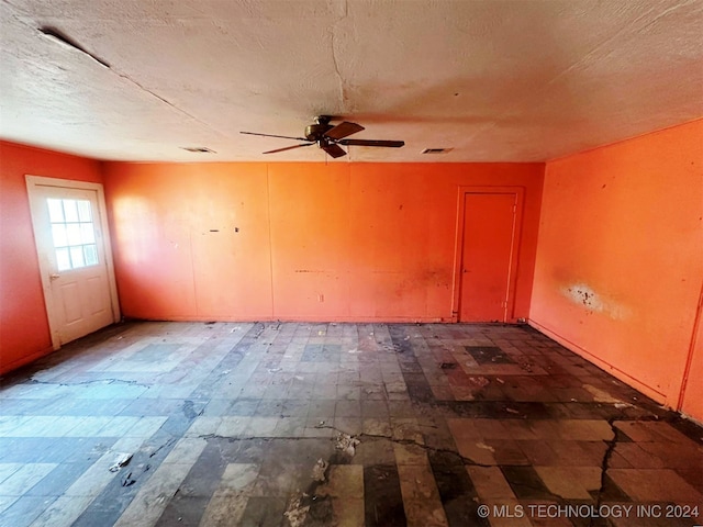 unfurnished room with ceiling fan