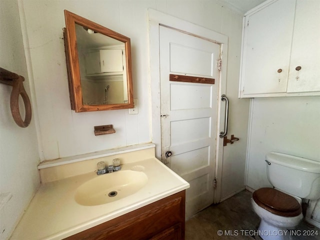 bathroom with vanity and toilet