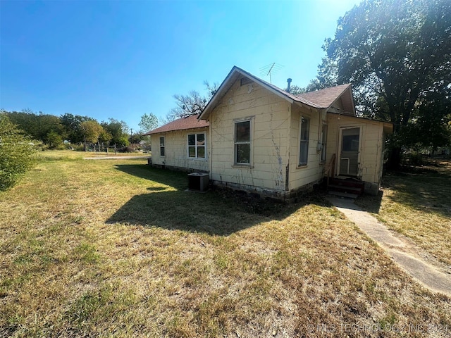 view of home's exterior with a yard