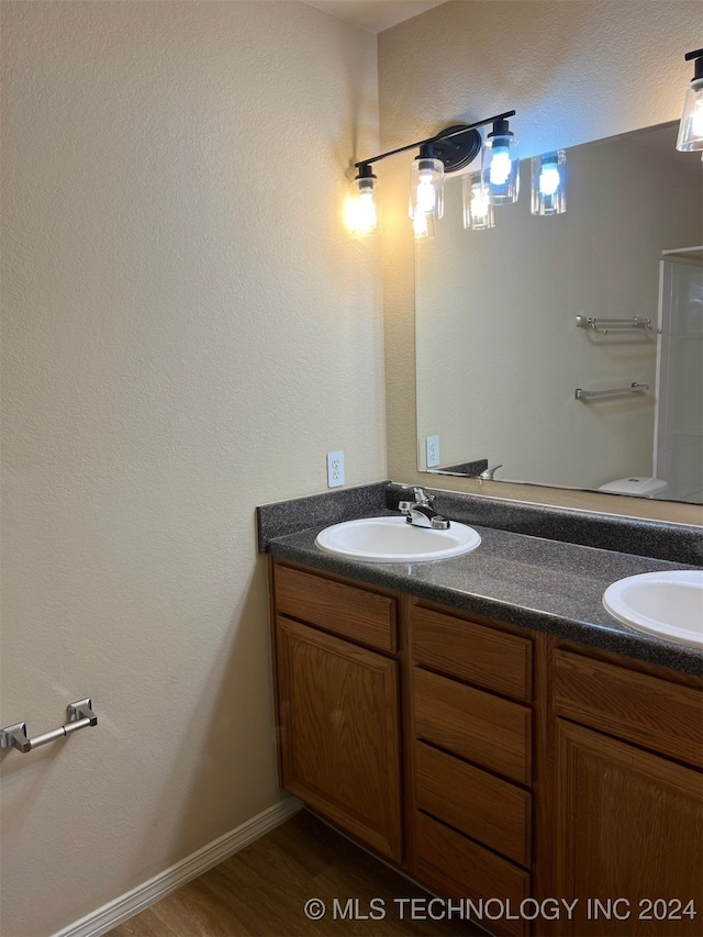 bathroom featuring vanity and wood-type flooring