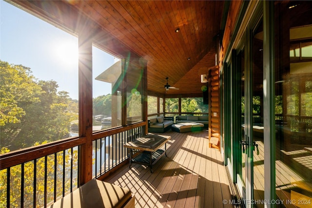 sunroom / solarium with wood ceiling and vaulted ceiling