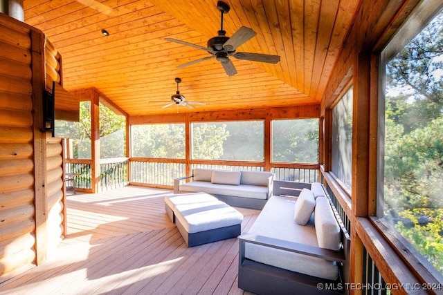 unfurnished sunroom featuring lofted ceiling and wood ceiling